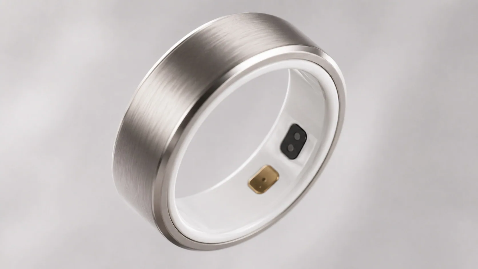 Orbi R1 smart ring showing titanium shell, ceramic inner band, optical sensor window and gold-PVD electrode.